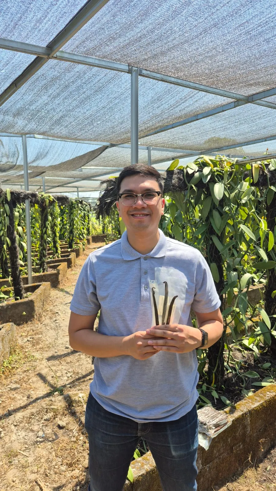 Founder of Familya Vanilla inspecting vanilla beans at an Indonesian plantation